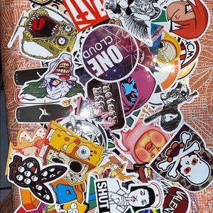 Fifty+ assorted laptop skateboard stickers